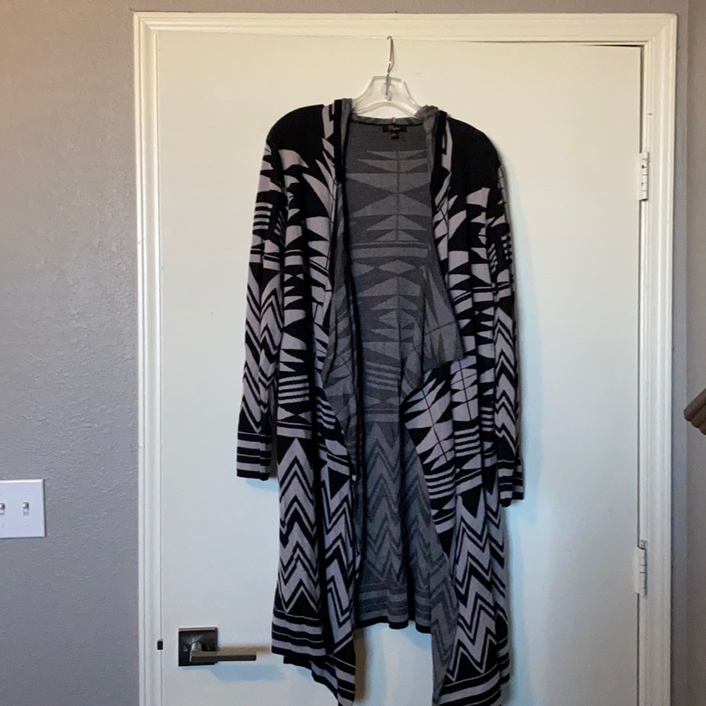 Women’s cardigan with hood. Black and brown pattern.